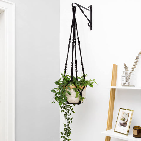 Mkono 35-inch macrame hanger in black creating height for planters indoors or outdoors