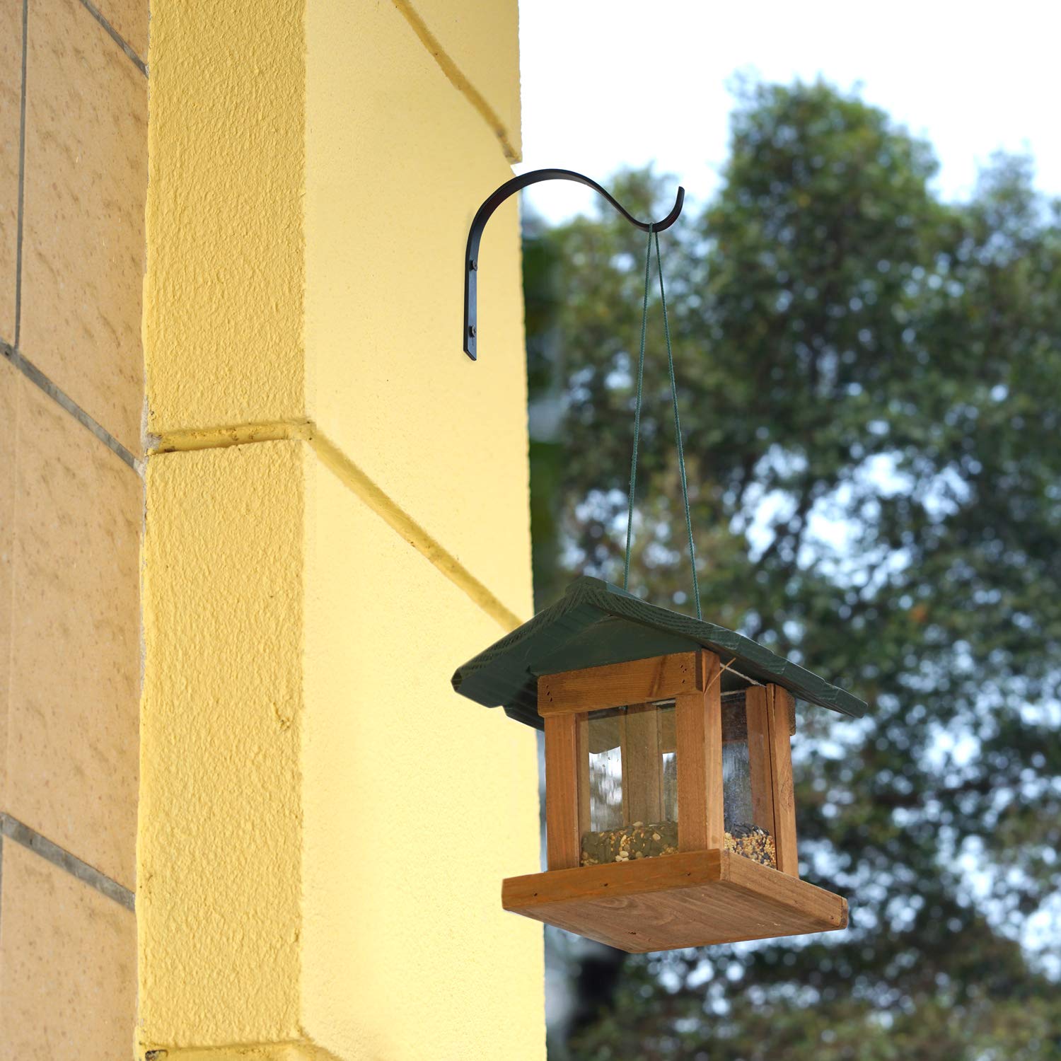 Mkono wall hooks used as plant hanger on a garden wall.