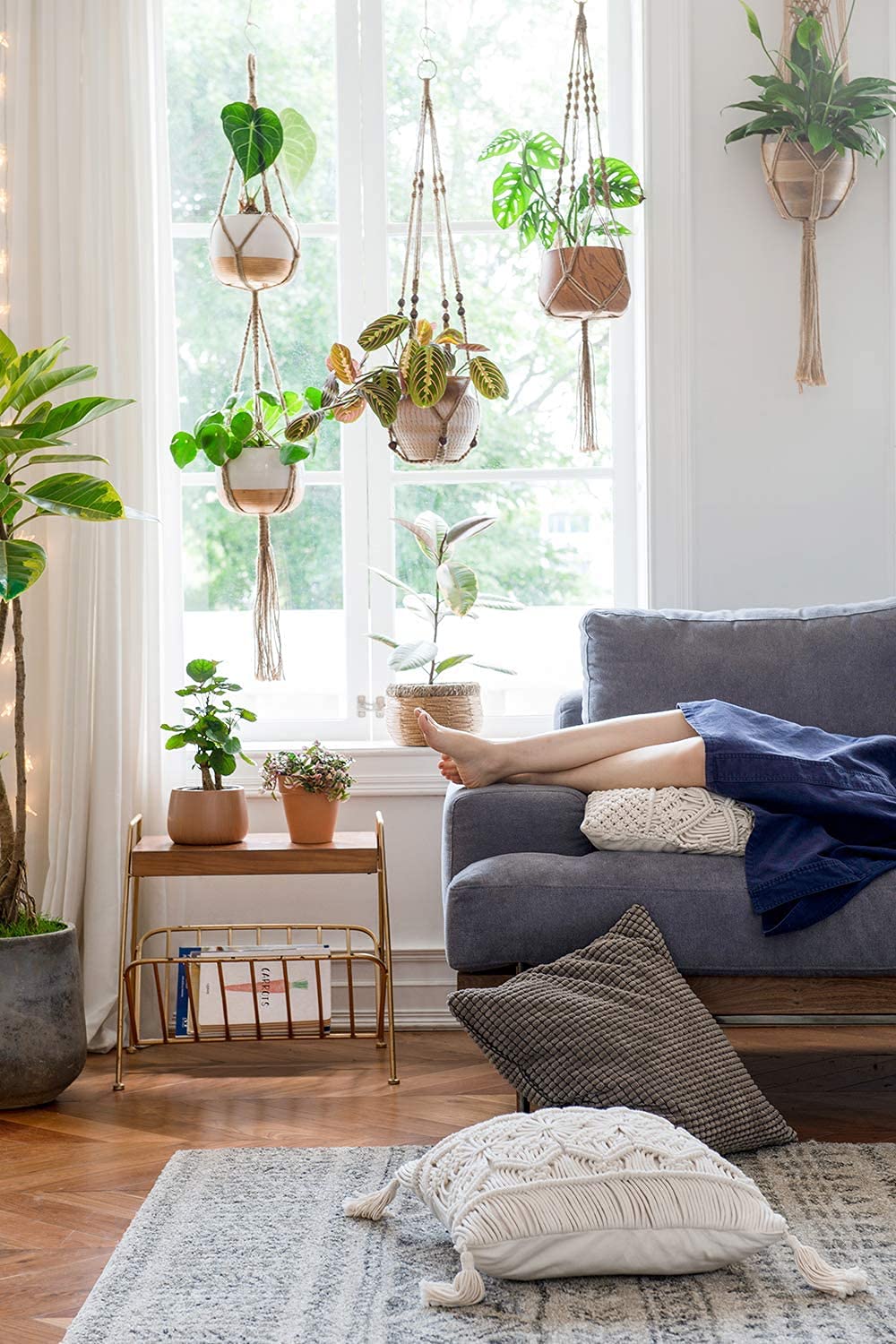Mkono boho decoration macrame plant holder complements shelves and walls with texture.