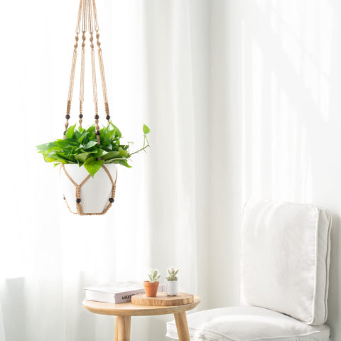 Mkono brown macrame hanger with wood beads enhances boho vibes in any room