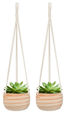 Mkono ceramic hanging planter with macrame hanger for stylish indoor display.