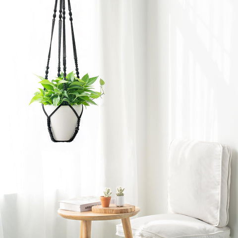 Mkono indoor outdoor macrame planter basket adds boho texture to spaces.