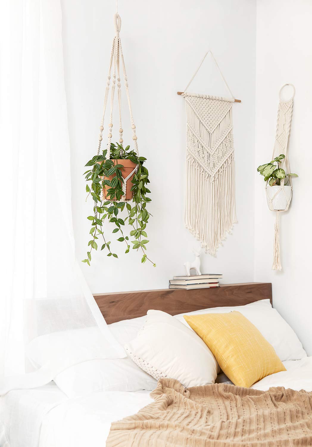 Mkono ivory plant hanger display on balcony for outdoor greenery.