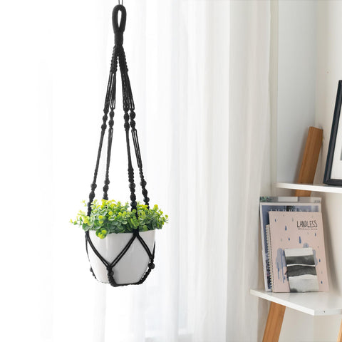 Mkono wall-hung macrame planter display with refined craftsmanship.