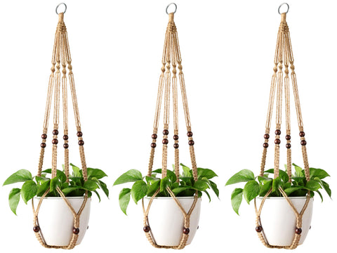 Mkono macrame plant hanger with wood beads enhances rustic decor in any room.