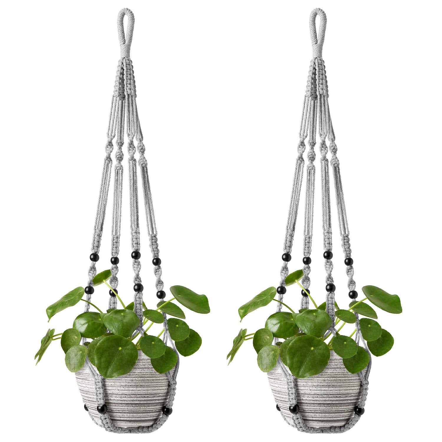 Mkono macrame plant hanger with wood beads adds vintage charm, elevating decor.