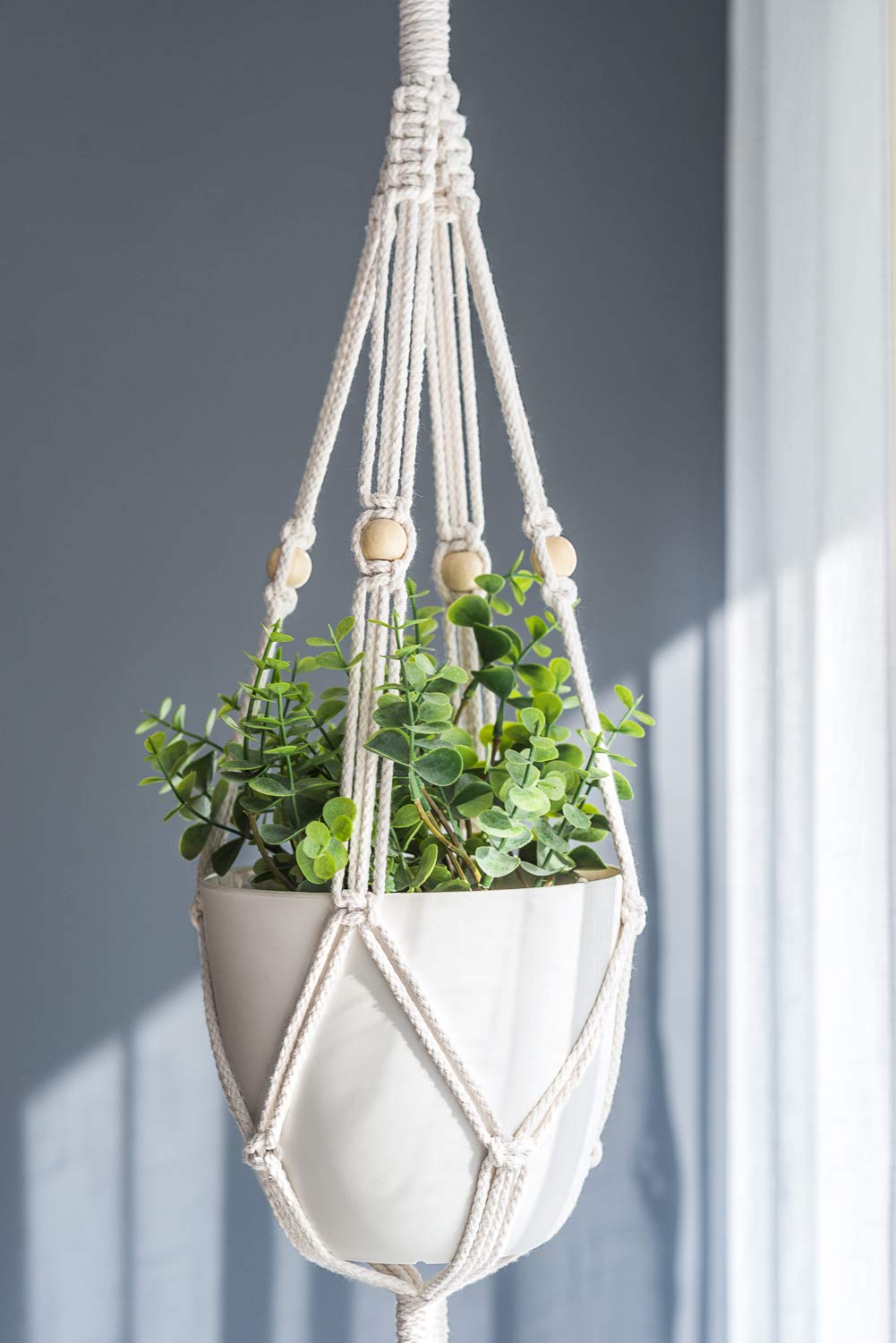 Mkono plant hanger fits 7-inch pots for easy color and pattern pairing.