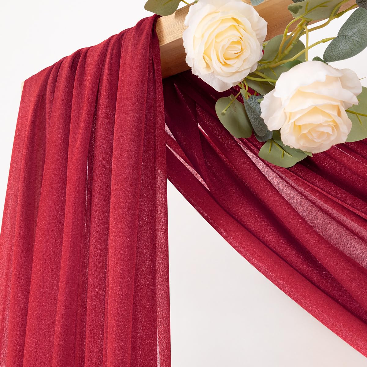 MLMC red wedding arch draping fabric hanging gracefully to create a romantic backdrop.