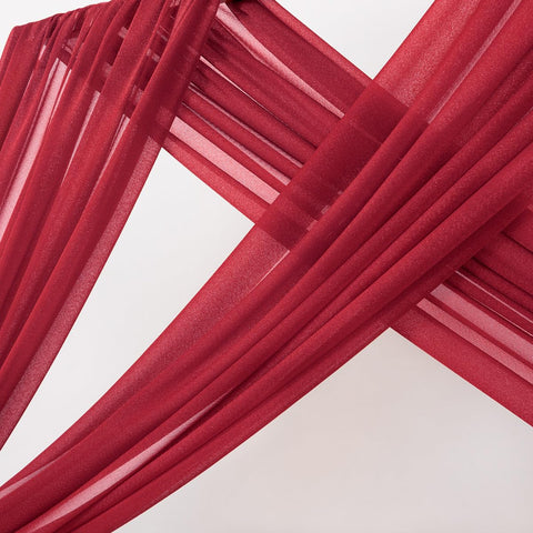 MLMC red wedding arch draping in venue setup provides an elegant ceremony backdrop.