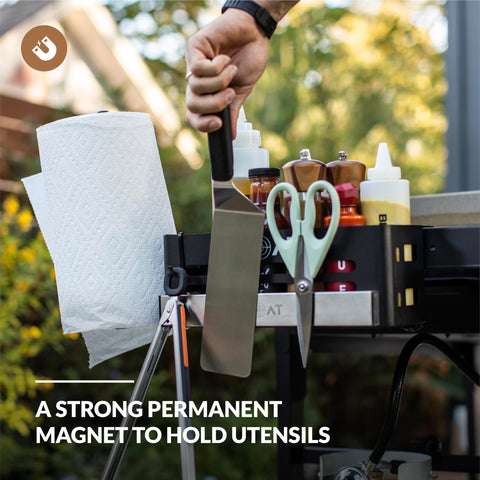 MOAT magnetic caddy mounted on Blackstone griddle for secure tool storage.