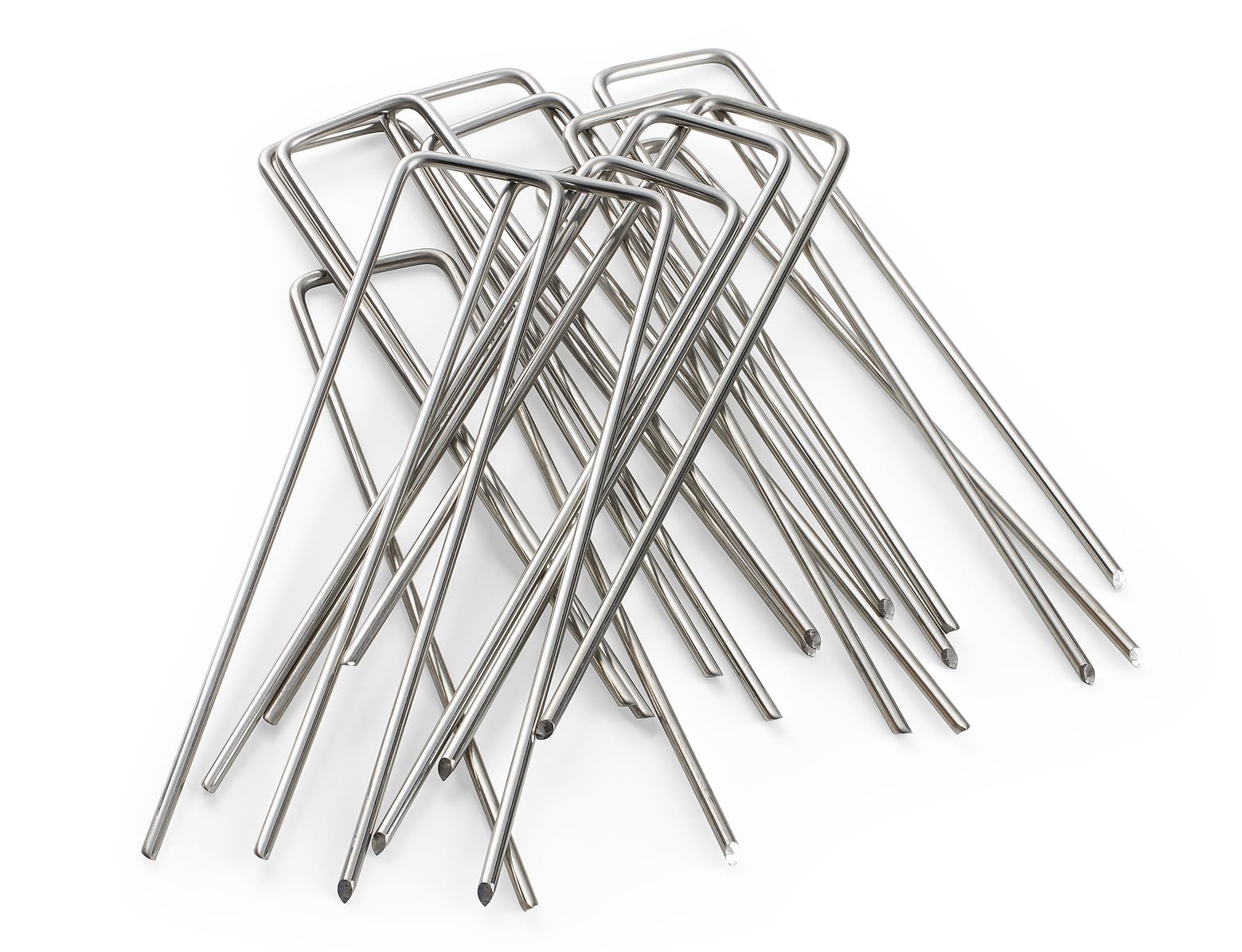 Modern Grower staples securing landscape fabric in soil for stable garden beds.