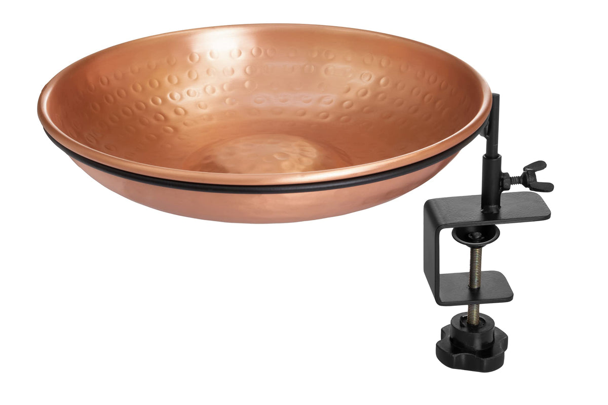 Monarch Abode copper bird bath bowl invites birds to drink in a sunny garden.