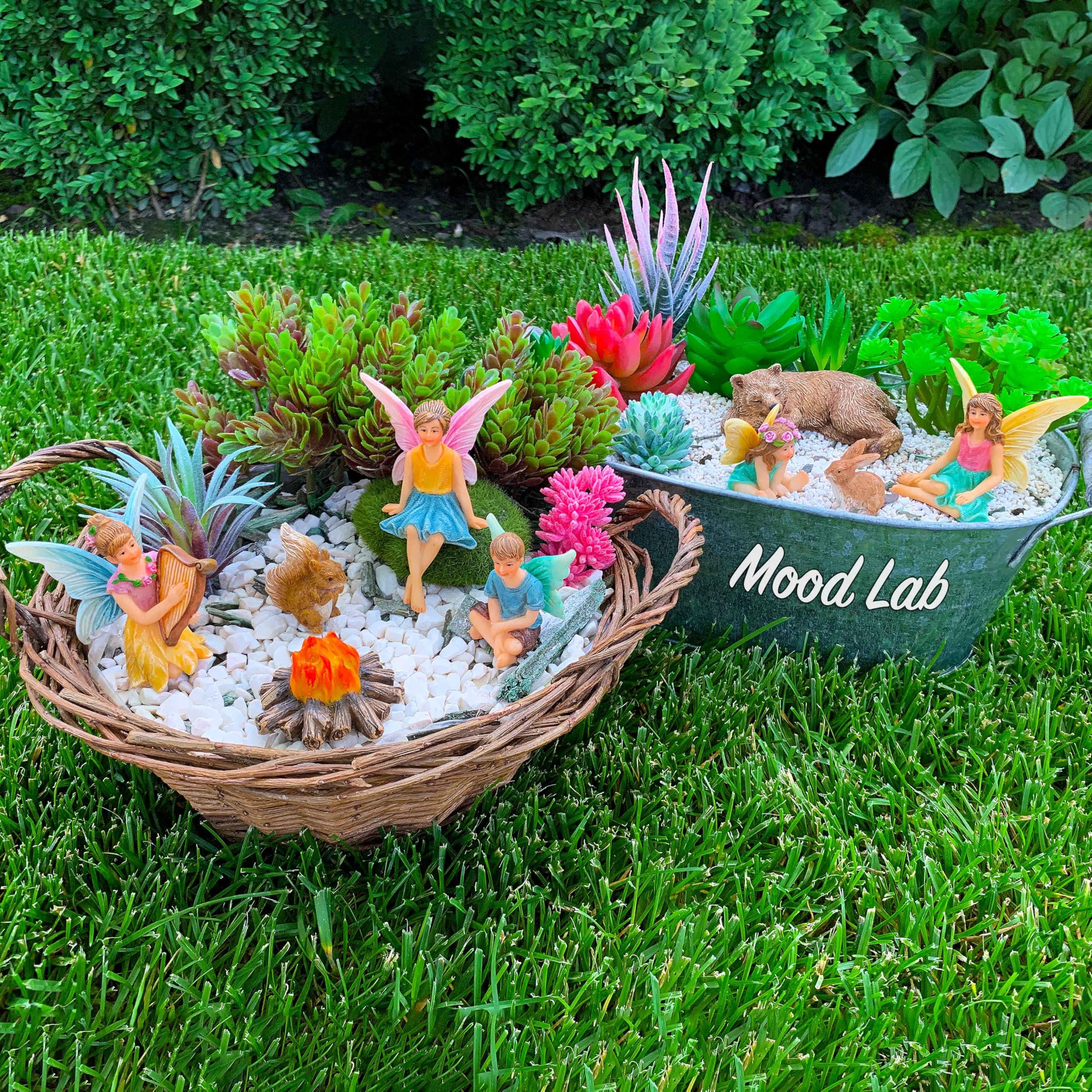 Mood Lab fairies and camping accessories arranged on a patio for storytelling