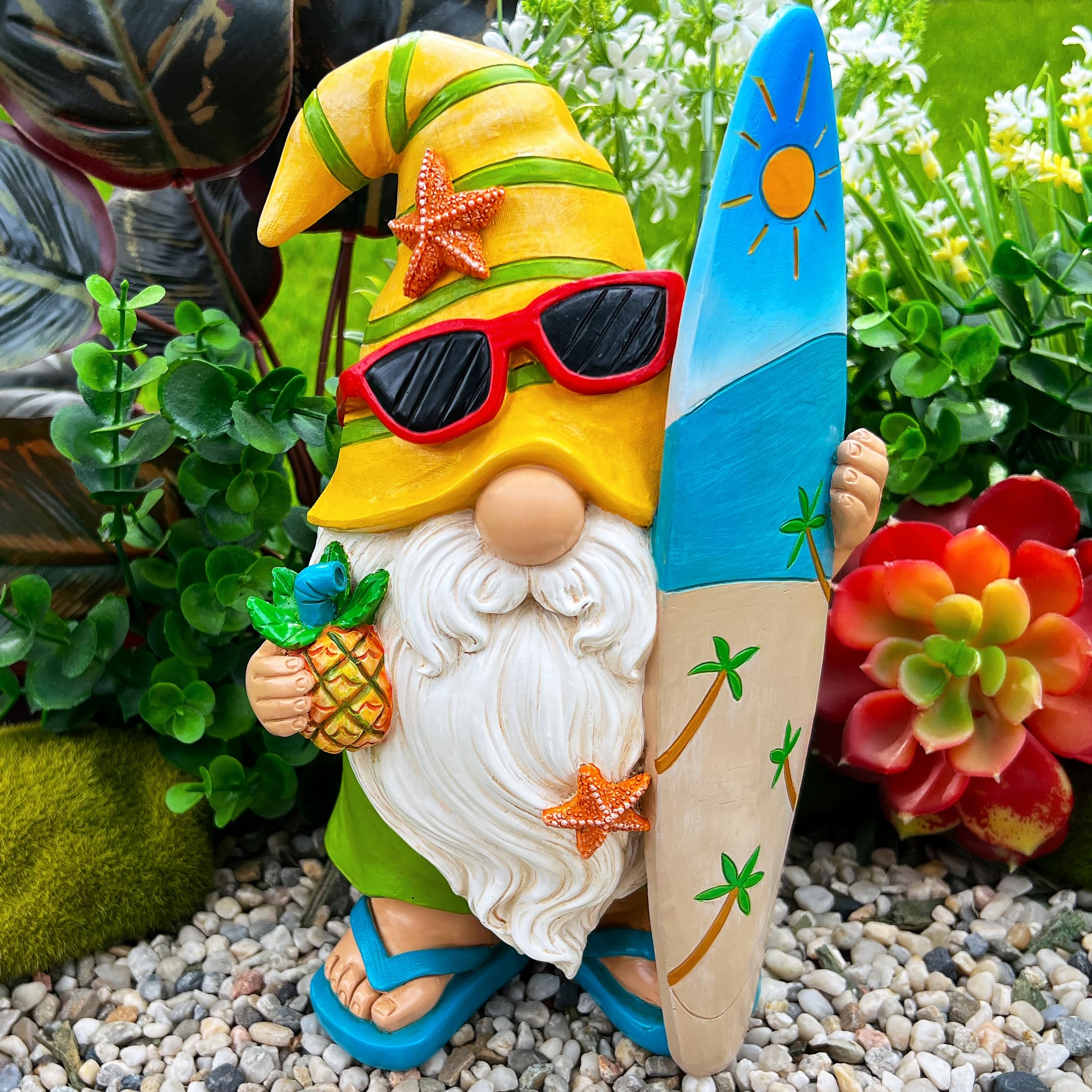 Mood Lab Garden Gnome Surfer figurine beside potted plants