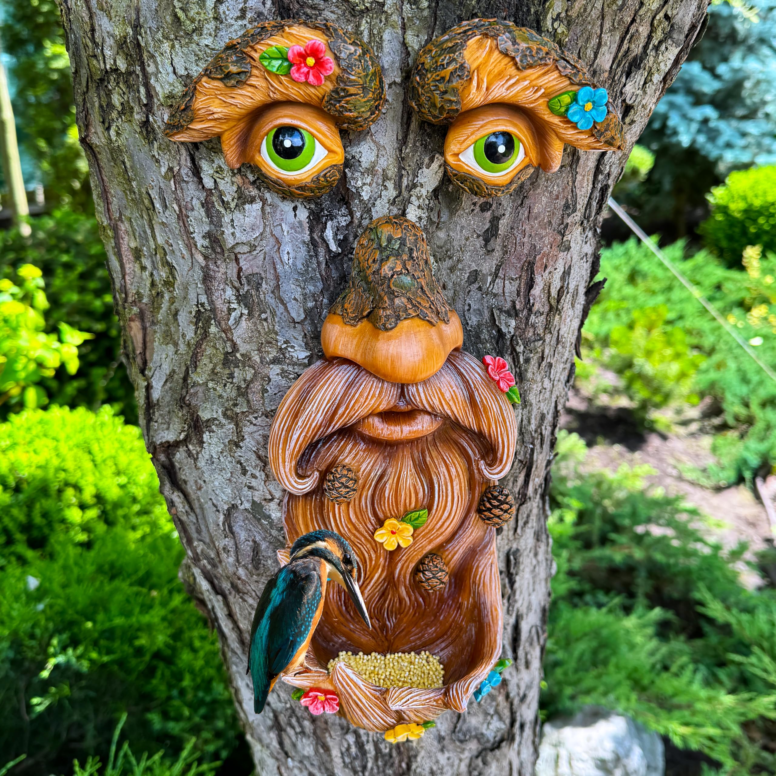 Mood Lab Tree Face Decor with flowers enhances garden color and character.
