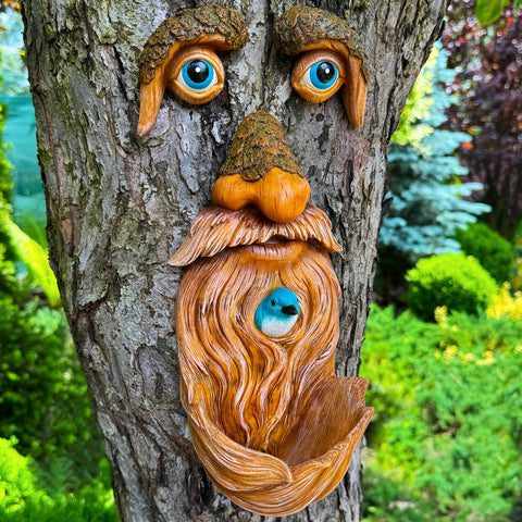 Mood Lab tree faces decor adds whimsy to your garden with an integrated bird feeder.