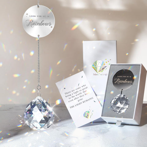 Mooncraftlogy clear crystal ball suncatcher displays a rainbow when sunlight hits it.