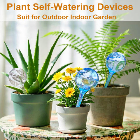 MOONSOUND self-watering globes in action keeping a planter hydrated.