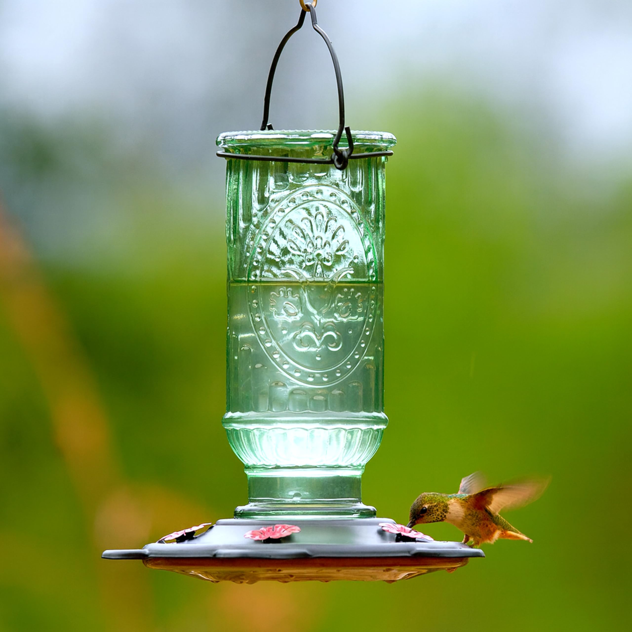 More Birds thick glass bottle with metal base cap for lasting durability.