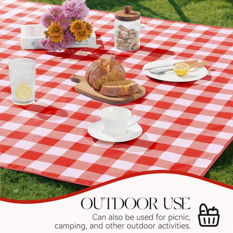 MOSAYT picnic setup with red gingham tablecloth under sun.