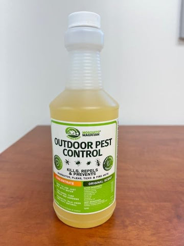 Mosquito Magician liquid concentrate bottle highlighting natural oil blend for outdoors.