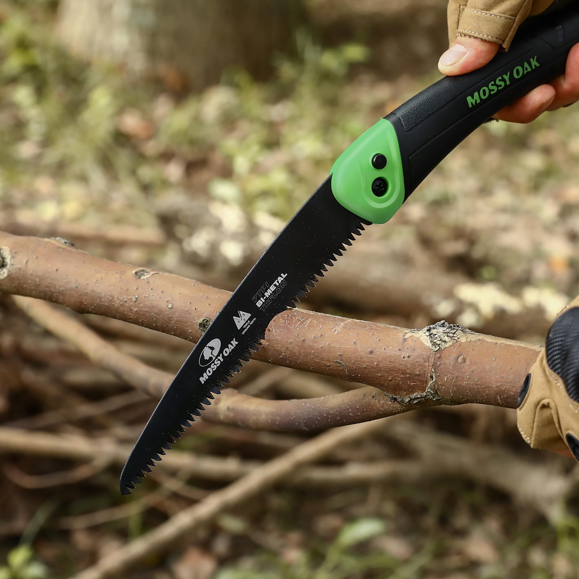 Mossy Oak folding saw in outdoor use, ready for hunting and camping tasks.