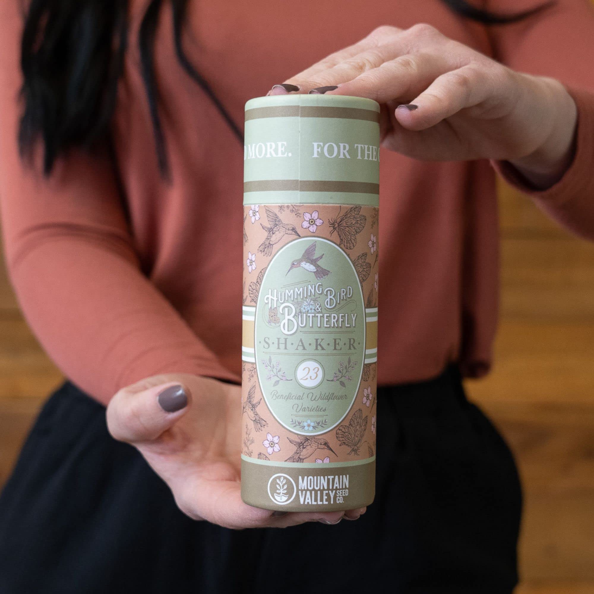 Mountain Valley Seed Co easy-to-sow seed shaker in hand.