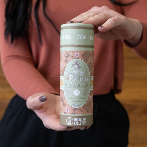 Mountain Valley Seed Co easy-to-sow seed shaker in hand.