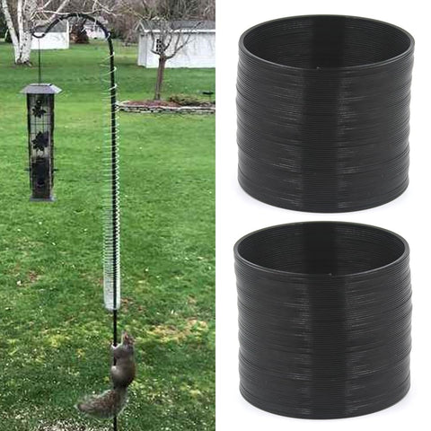 Movbudy squirrel baffle at pole elbow with zip tie for feeder protection