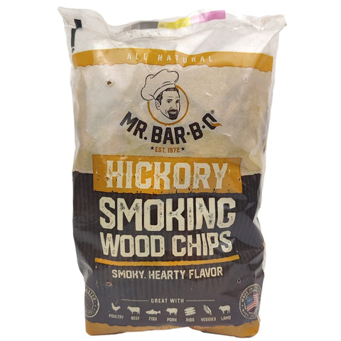 Mr. Bar-B-Q Hickory chips bag on grill for authentic smoky flavor.