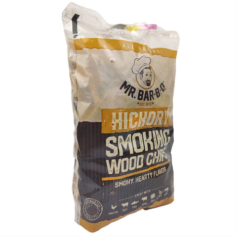 Chips beside grill releasing savory BBQ aromas.