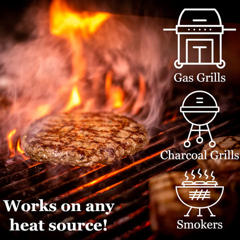Smoke rising as chips infuse meats and vegetables.