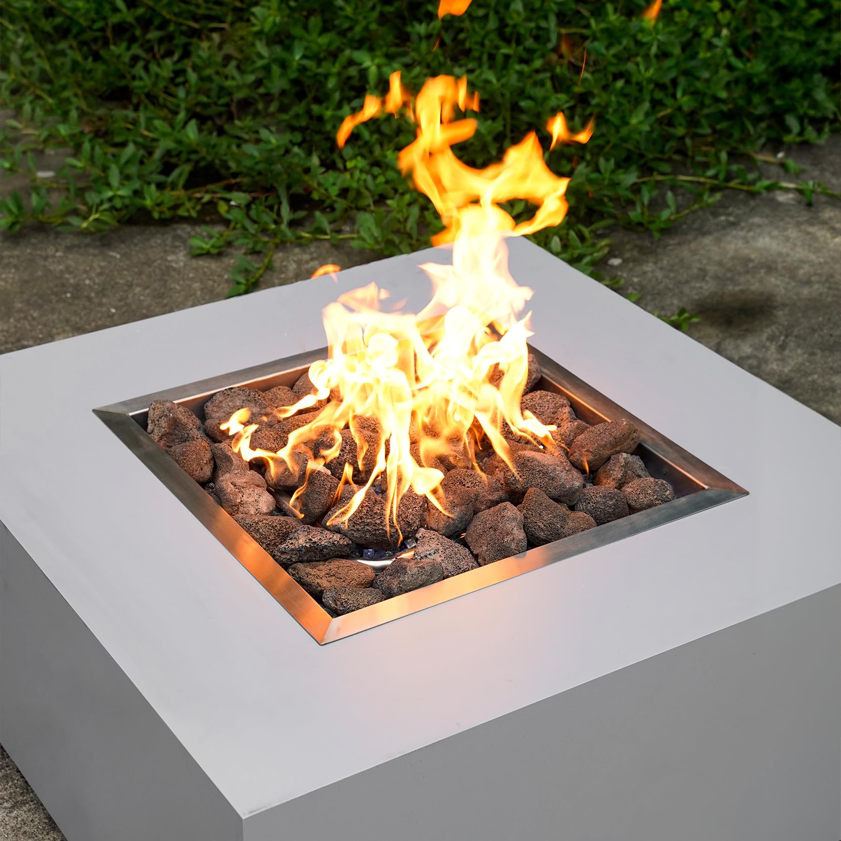 Mr. Fireglass lava rock used in a gas log set for authentic look.