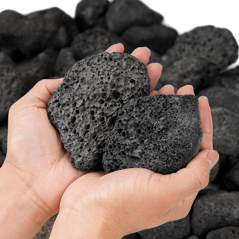 Mr. Fireglass lava rock in a pit under flame for even spread.