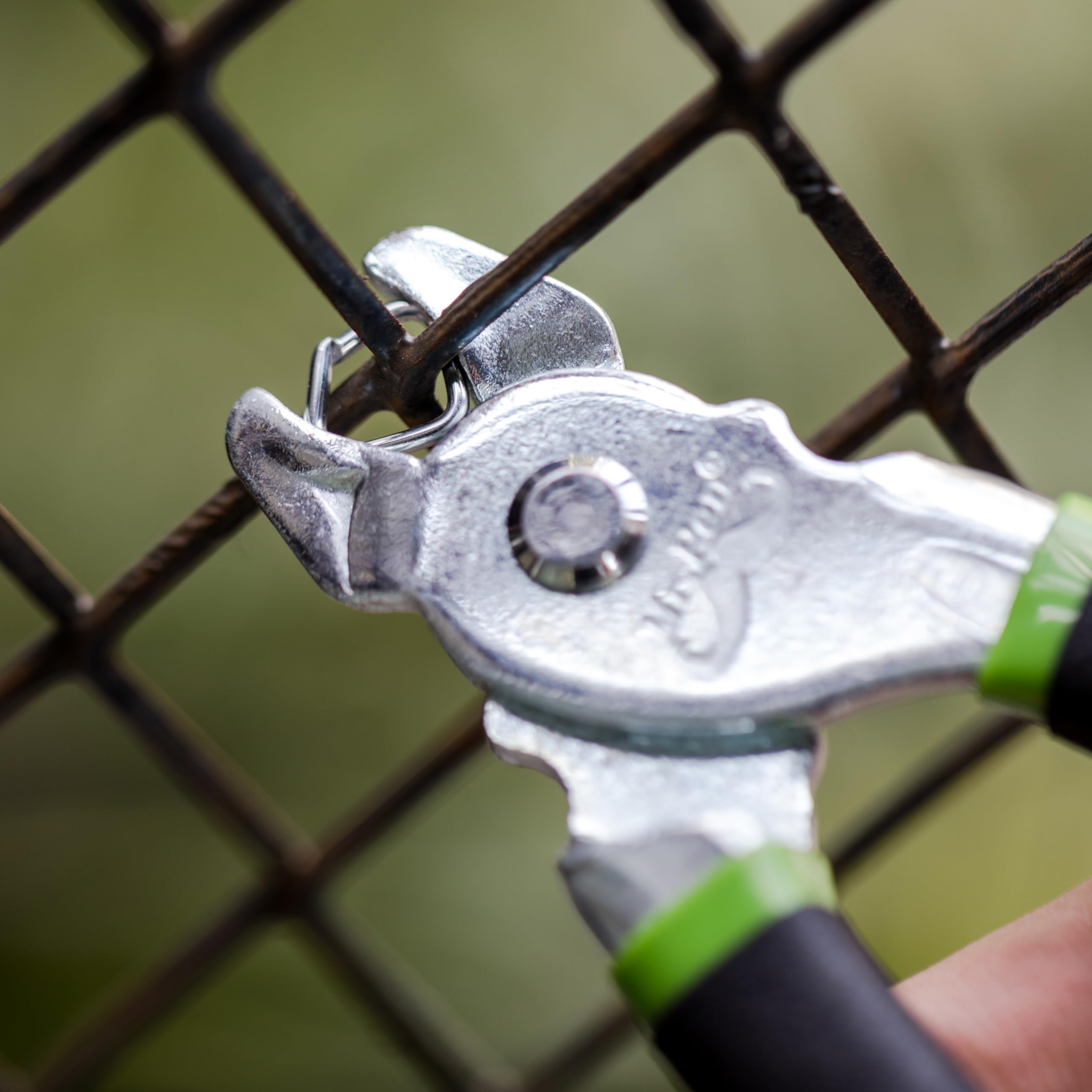Fence installation using Mr. Pen hog rings to secure wire mesh.