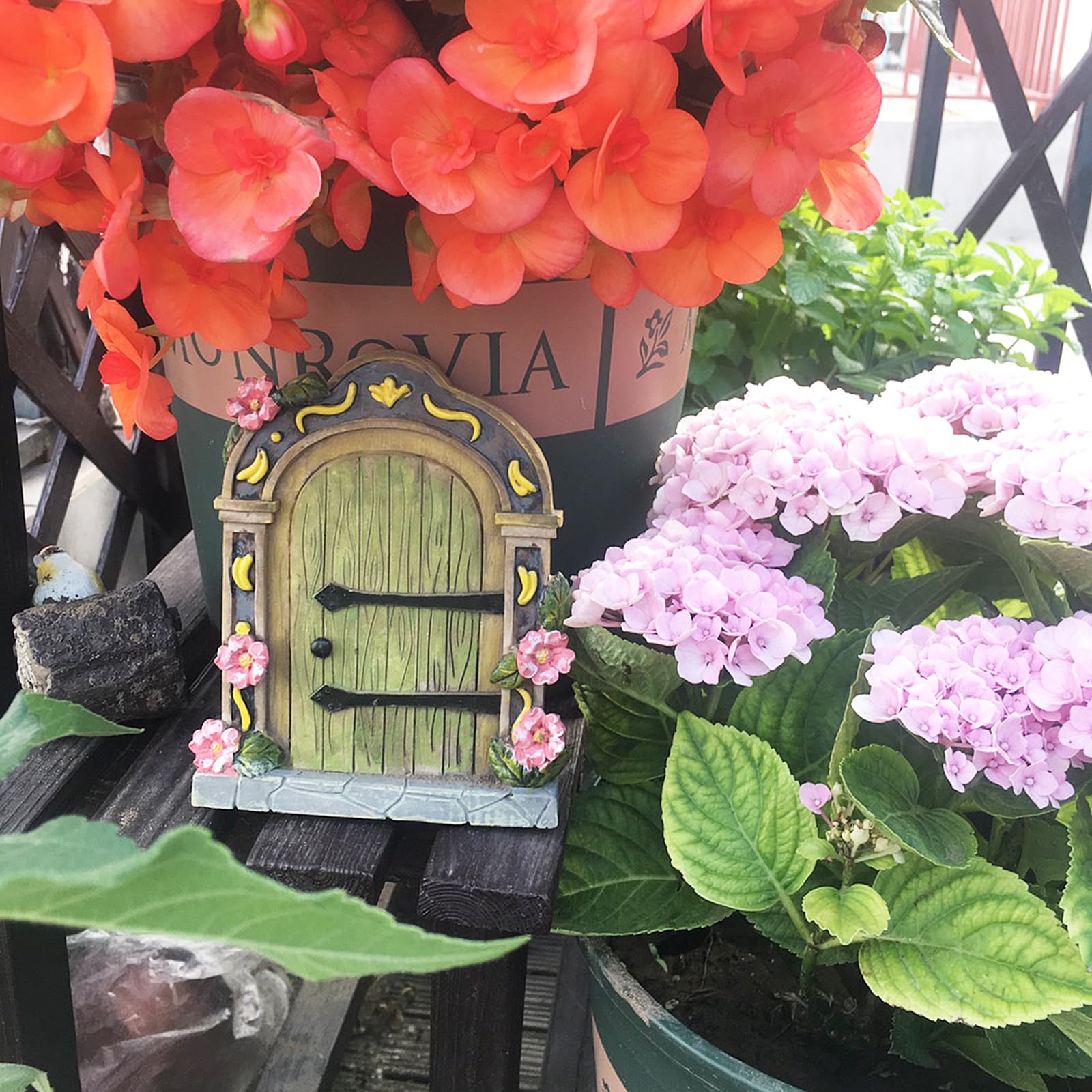 MUAMAX green door shown mounted on a tree trunk for magical appeal
