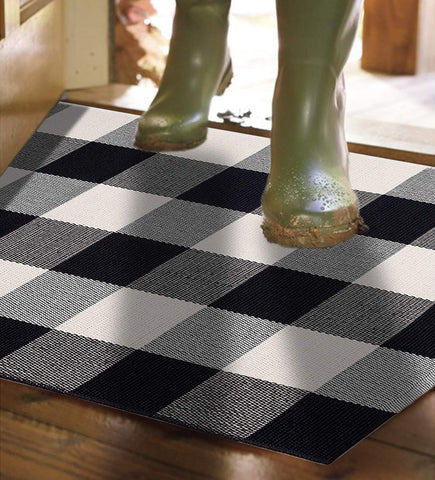 MUBIN buffalo plaid rug placed on a patio for outdoor-use styling.
