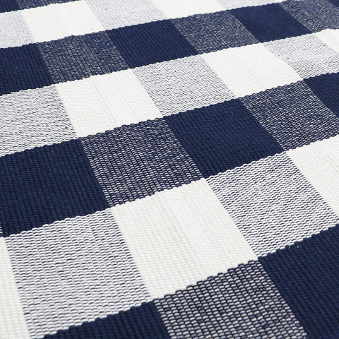 MUBIN buffalo plaid rug on porch pairs with layered mats.