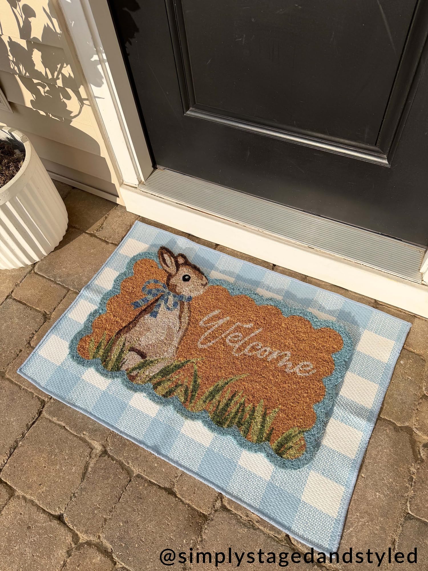 Mud Pie brown scalloped doormat blends rustic style with durable everyday use.