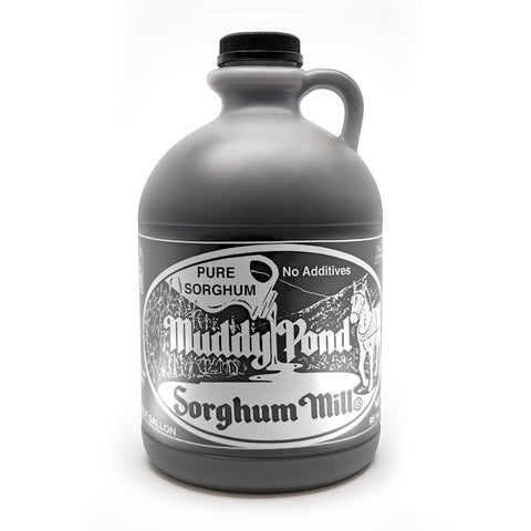 Muddy Pond Sorghum bottle close-up reveals rich amber color, ideal for natural sweetness on pancakes.