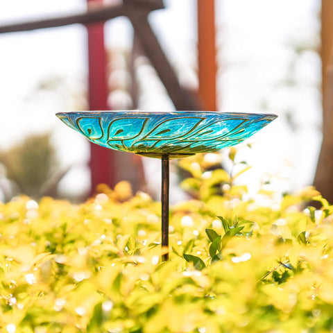MUMTOP outdoor glass bird bath placed in garden or patio area.
