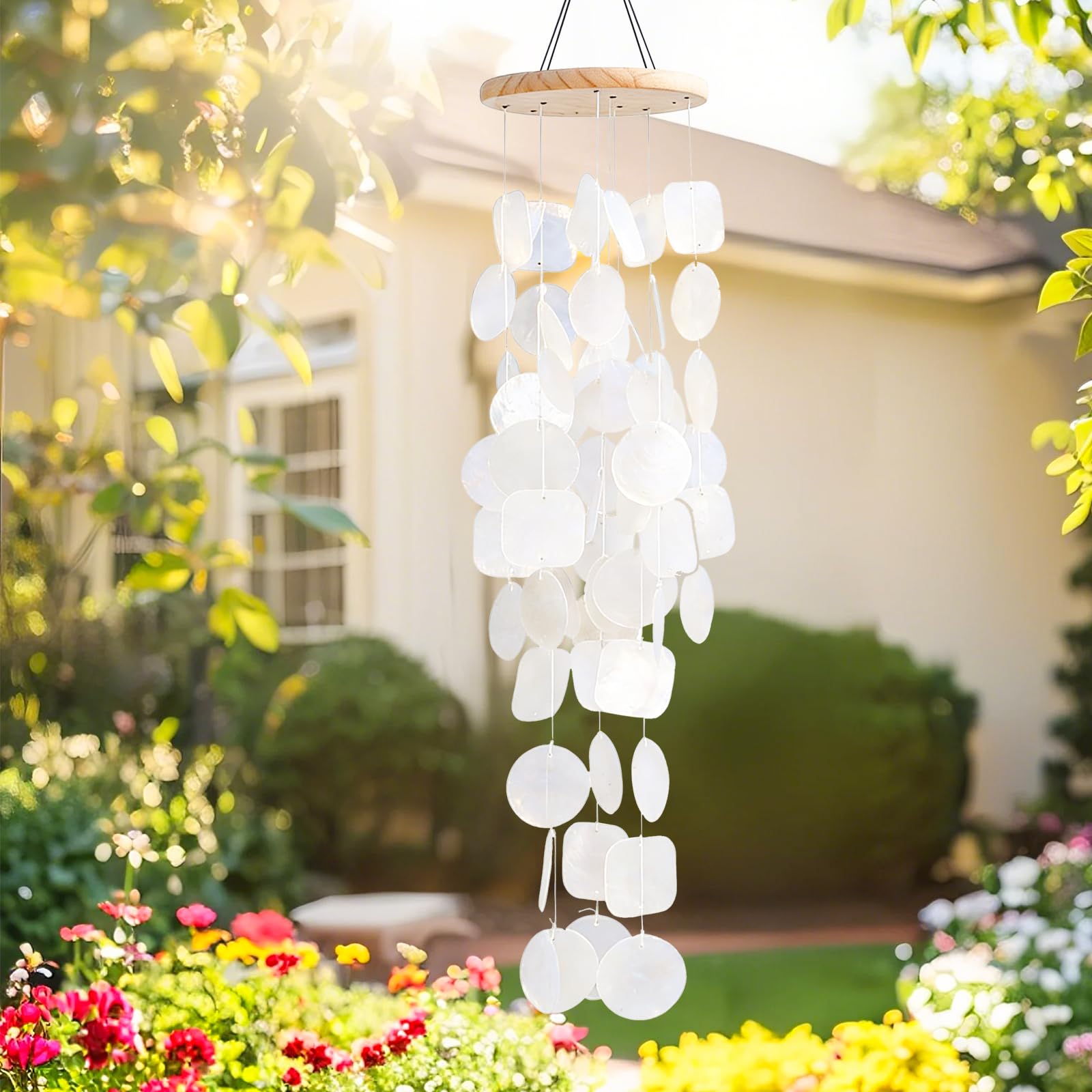 MUMTOP close-up of white capiz shells on wind chime.