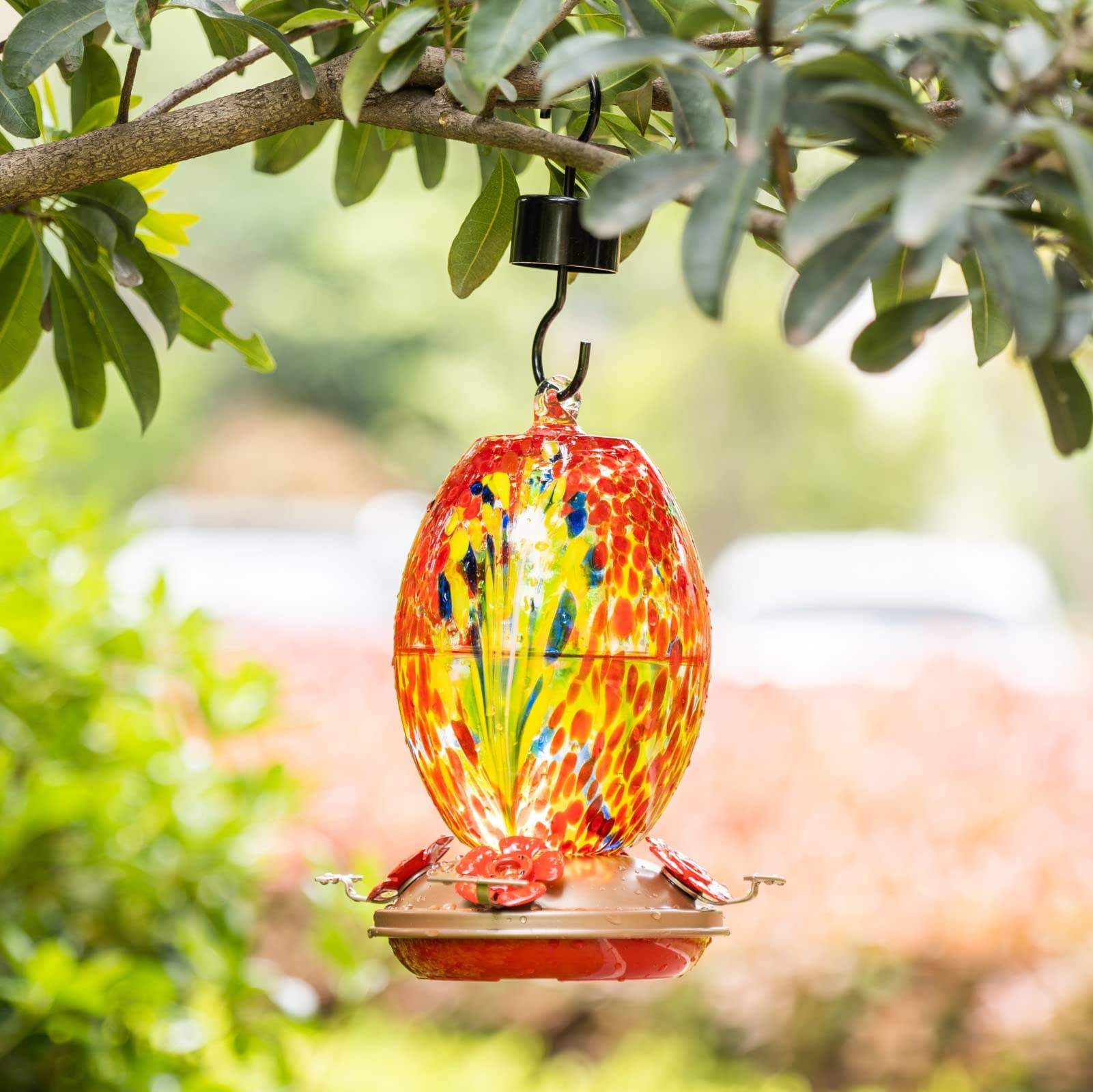 Muse Garden hand-blown glass bottle highlights craftsmanship for lasting garden decor.