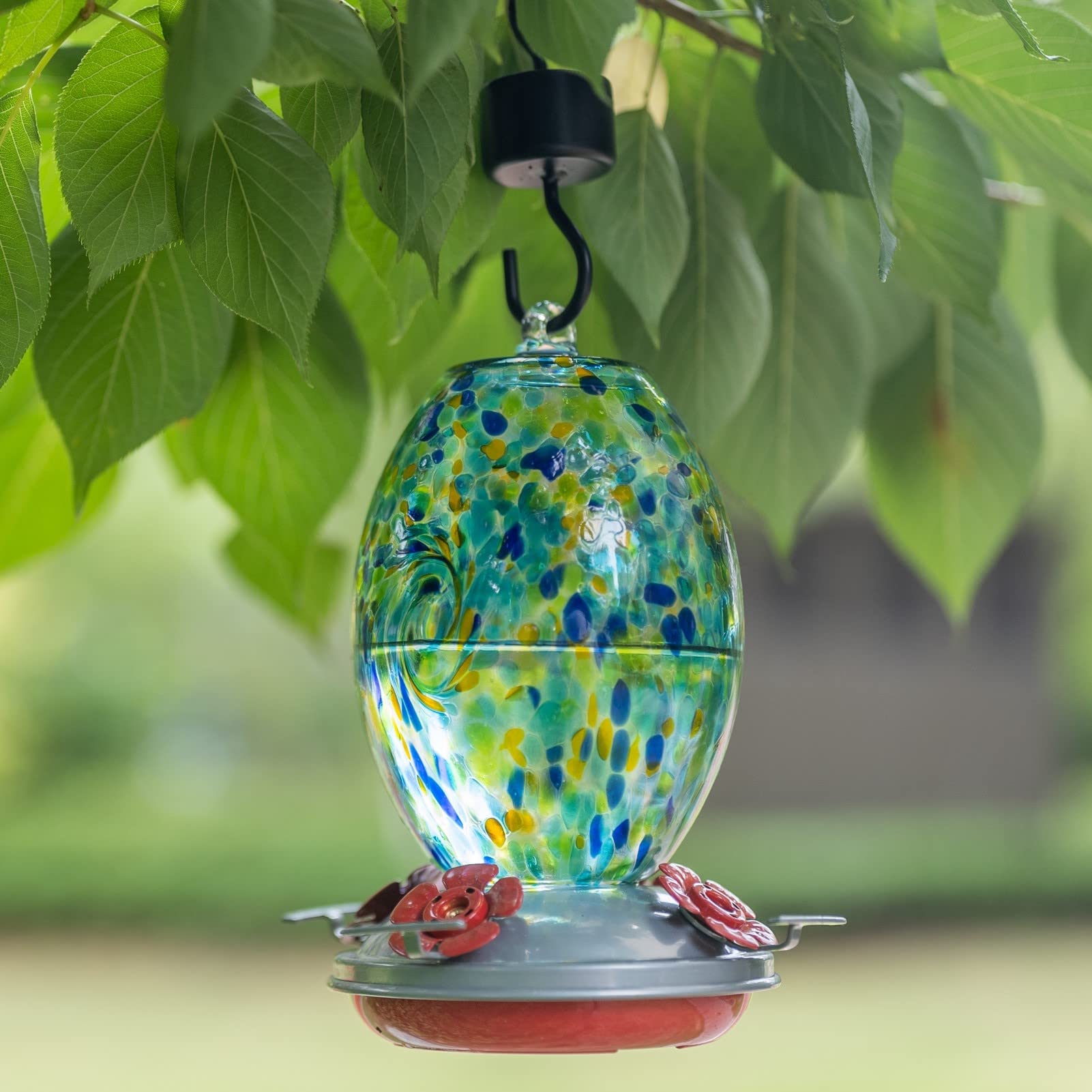 Muse Garden hand-blown glass feeder adds artisanal beauty to any outdoor space.