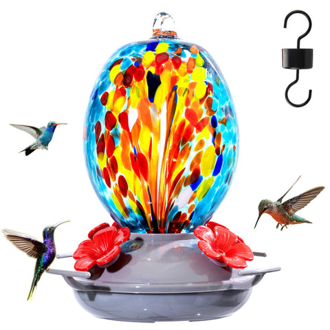 Muse Garden hand blown hummingbird feeder in blue fireworks glass attracts hummingbirds outdoors.