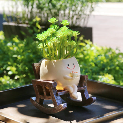 MUZZIOU Smiley Planter front view with rocking chair, ideal for small succulents.