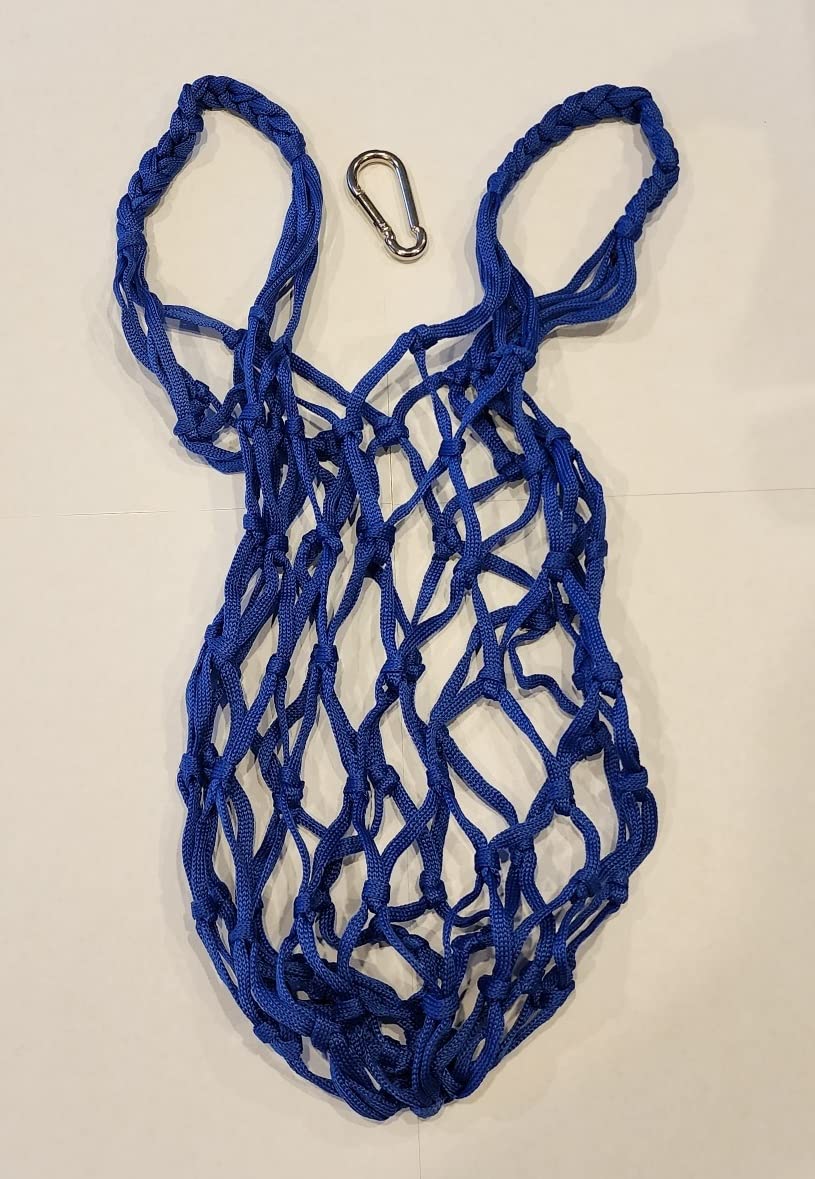 Muzzys blue coop treat bag mounted in a hanging setup above the run