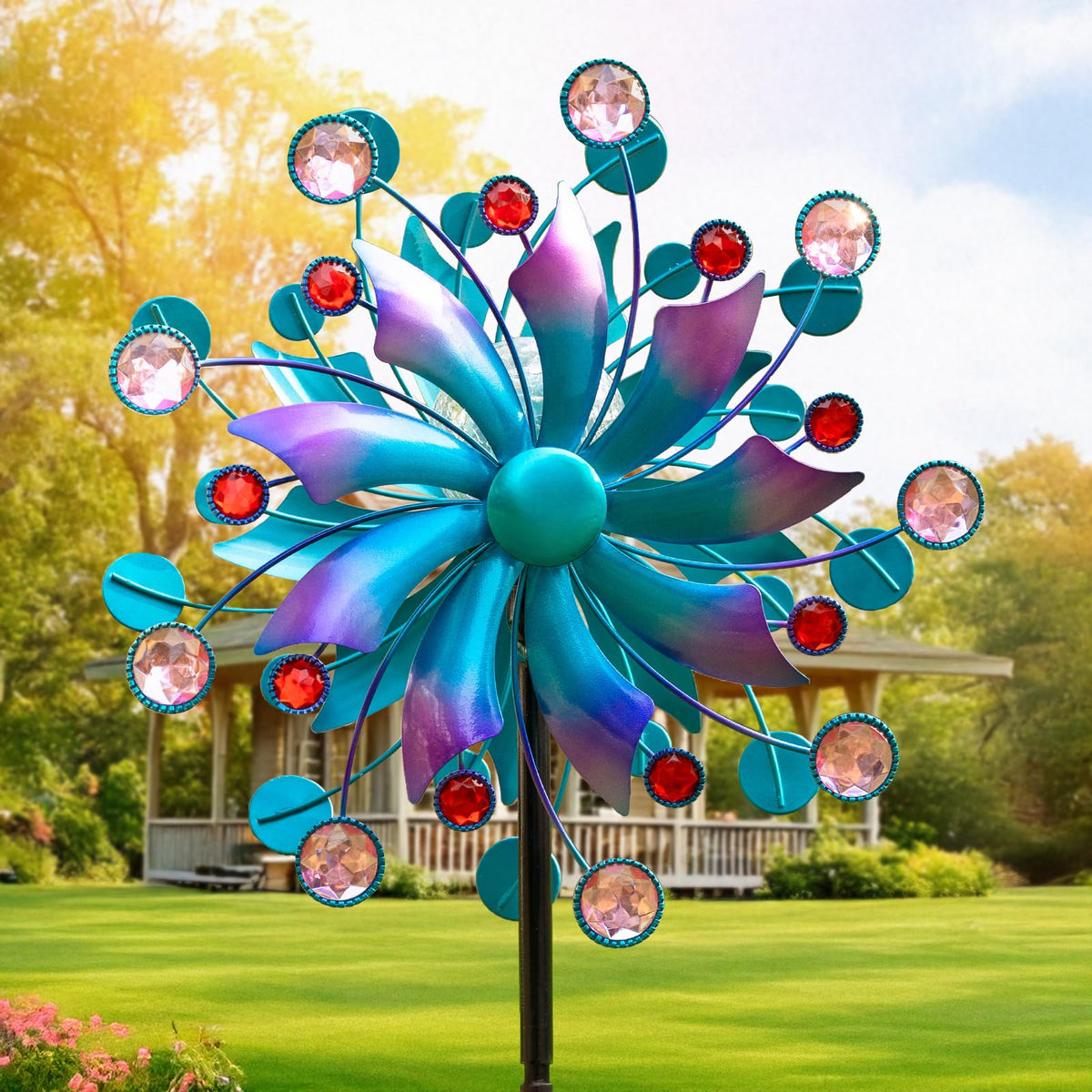MXwcy solar wind spinner globe light glows softly to enhance evening garden ambience.