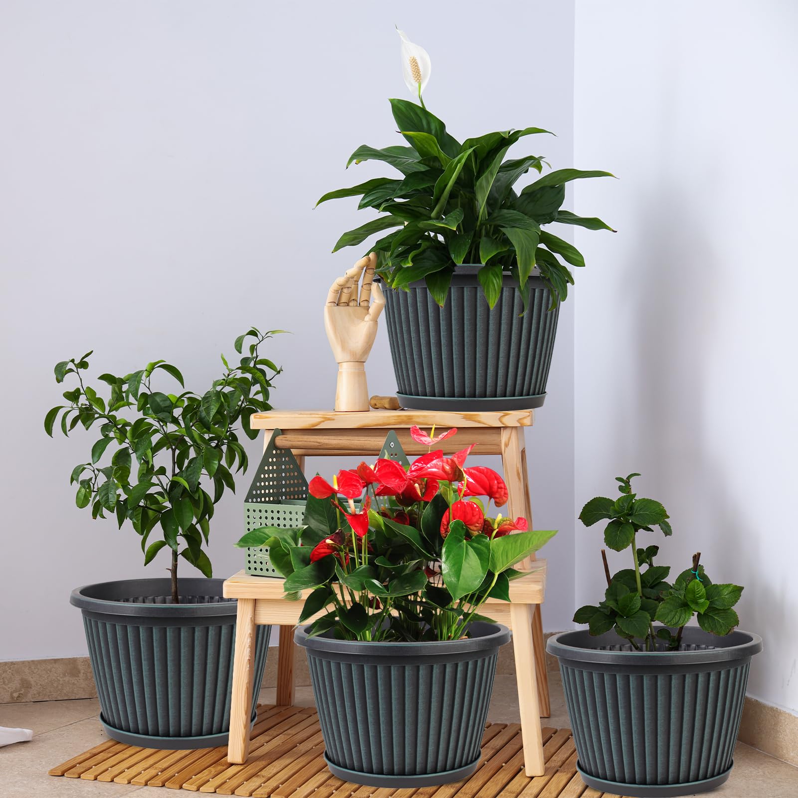 Myfeegoin planter with four drainage holes and included saucer for overflow control.