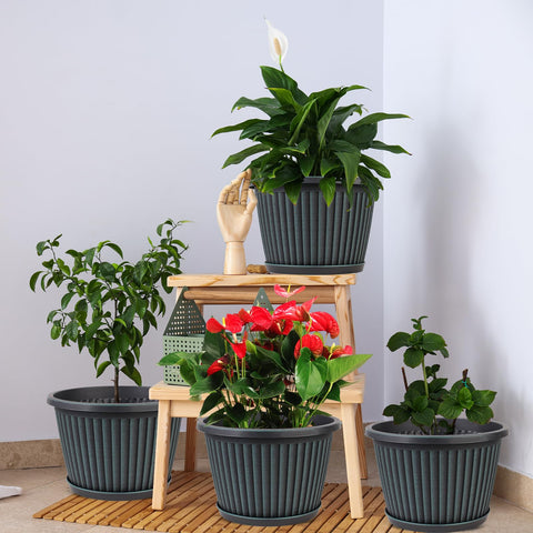 Myfeegoin planter with four drainage holes and included saucer for overflow control.